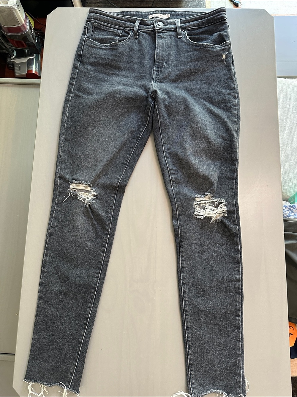 Levi's 721 High Rise Skinny Black Distressed Jeans with Raw Hem